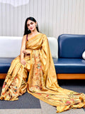 Gold Kalamkari print saree with intricate designs, worn by a model.