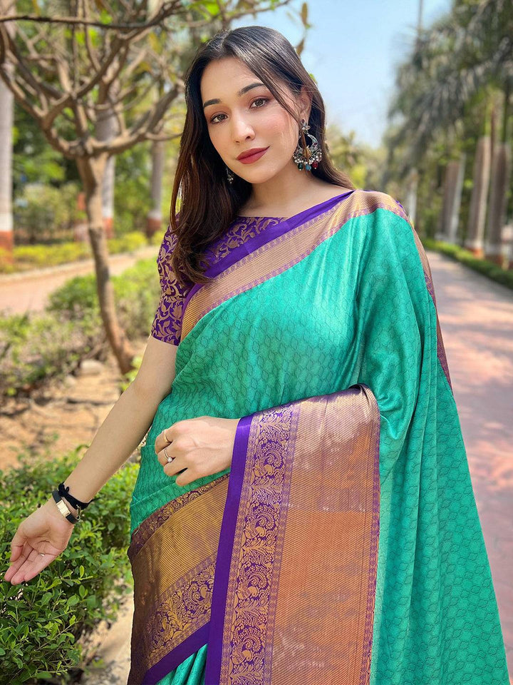 Turquoise Kanjivaram silk saree with brocade zari blouse outdoors