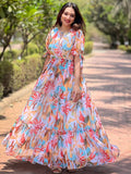 Woman in rainbow abstract printed dress outdoors