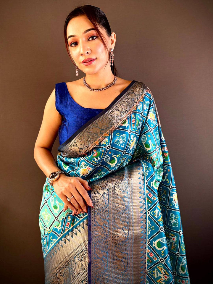 Ombre Sky Blue Soft Silk Patola Print Saree draped elegantly.