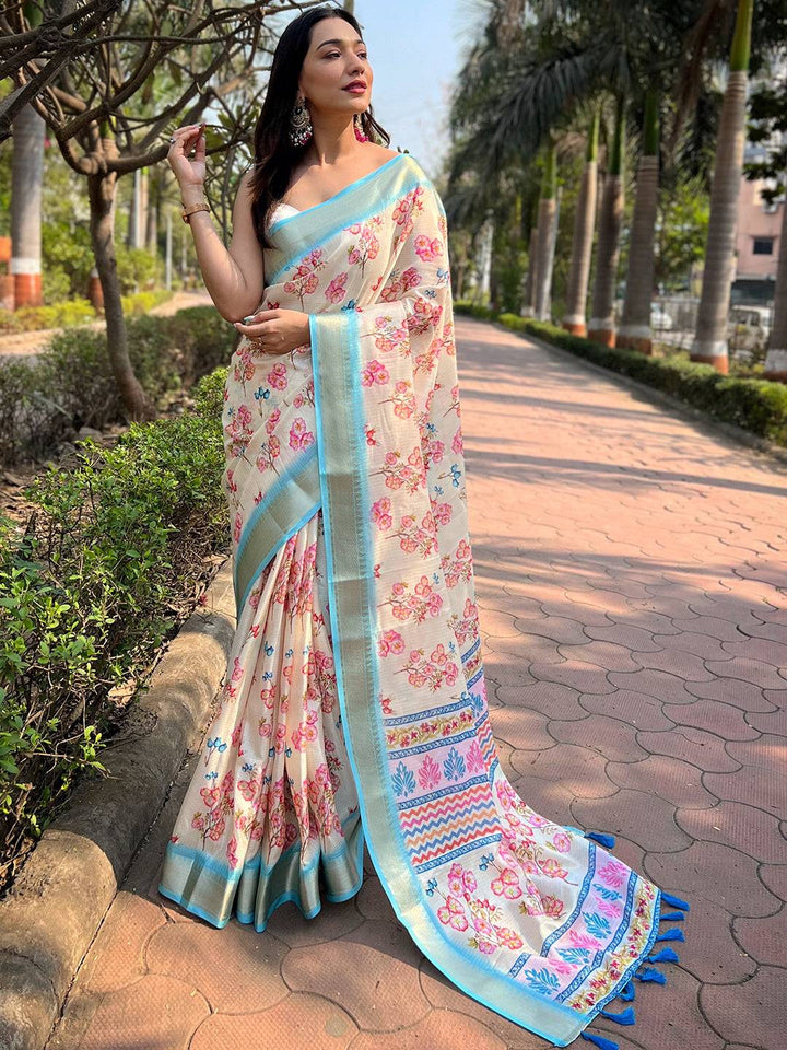 Cream Kota saree with digital floral print, worn outdoors