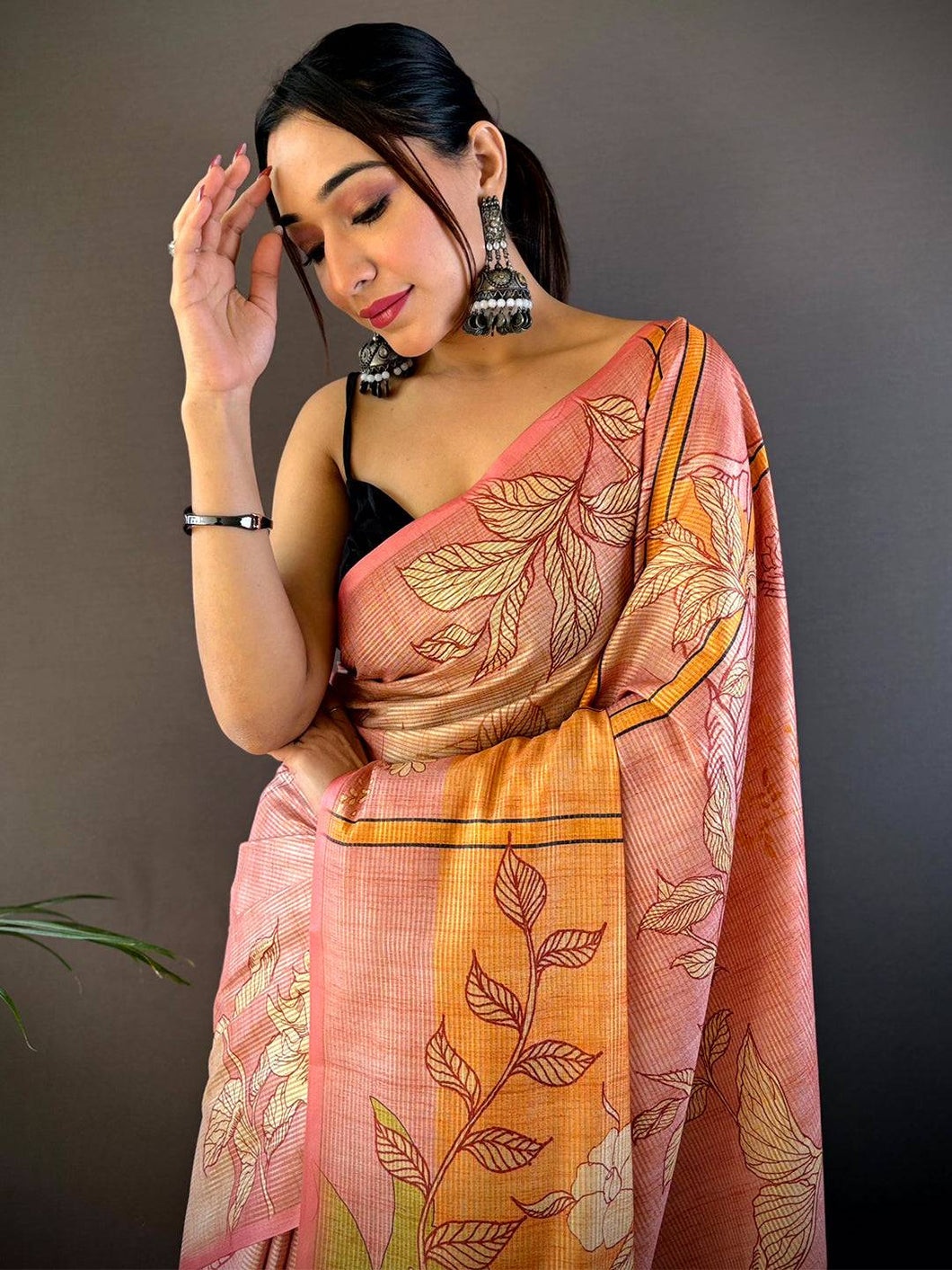 Pink abstract floral zari tussar saree with intricate design