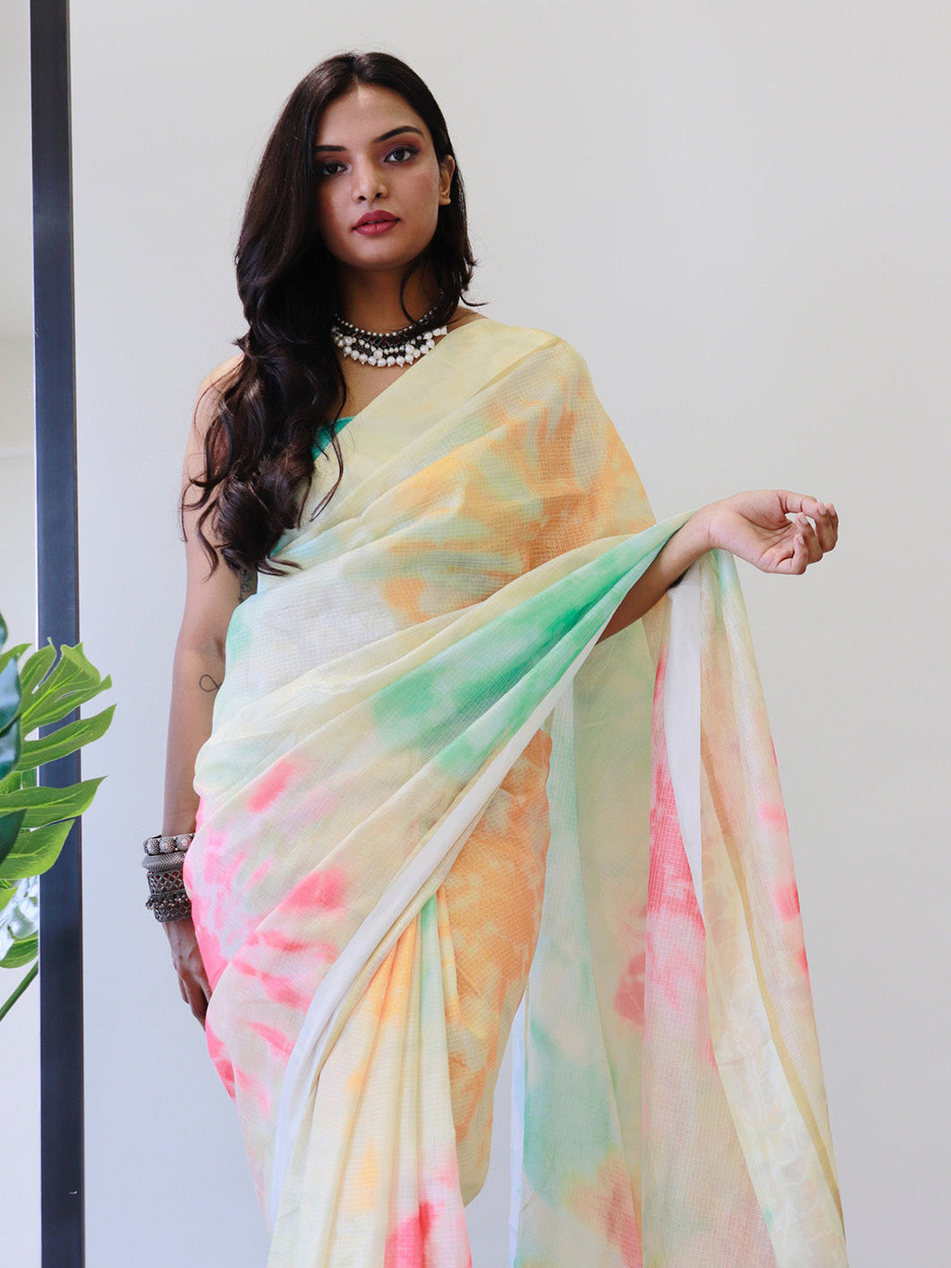 Model in multi-color tie dye digital printed saree